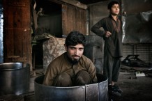 Mohammad Anwar, 30 years old, and Obaid, 11 years old, metal box makers. Jalalabad, 2012