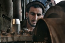 A worker of a factory of spare parts for engines and machines. Jalalabad, 2013