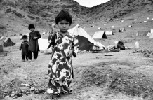 In a refugee camp. Kabul, Afghanistan, 2003. After the end of 2001, three and a half million Afghans have repatriated from the refugee camps of Pakistan and Iran. The humanitarian organizations’ aids were not enough, and most of the refugees found themselves once again in the camps.