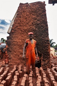 Trevor, 23, brick kiln worker. The red beret indicates membership of the resistance pressure movement People Power. Kampala, Uganda, 2023