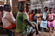 Caring heart infant school, the school attended by Ssekyanzi Lawrence, a patient of the Children's Surgical Hospital. Ssekyanzi, (foreground), 7 years old, still goes to kindergarten. There are 53 students in his class. Kawaala, Busunju, Mityana. Uganda, 2023